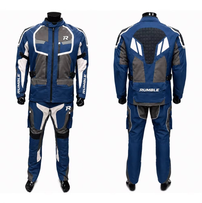 Motorcycle rider standing in full protective gear
